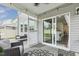 Covered porch area with outdoor seating and view into dining area at 575 Dawley Dr, Fuquay Varina, NC 27526