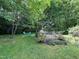 Expansive backyard with seating area and a delightful flower garden, perfect for relaxation at 5817 Wintergreen Dr, Raleigh, NC 27609