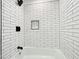 Bright bathroom featuring subway tile, a niche, and a modern shower head at 5817 Wintergreen Dr, Raleigh, NC 27609