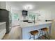 Bright, open kitchen with a large island, stainless steel appliances, and plenty of natural light at 5817 Wintergreen Dr, Raleigh, NC 27609
