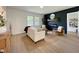 Bright living area with modern decor, light wood floors and an electric fireplace at 5817 Wintergreen Dr, Raleigh, NC 27609