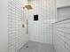 Walk-in shower with subway tiles, modern shower head, and neutral coloring at 5817 Wintergreen Dr, Raleigh, NC 27609