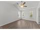 Sunlit bedroom featuring vaulted ceilings, a ceiling fan, and multiple windows at 620 Hanska Way, Raleigh, NC 27610