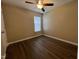 Clean bedroom featuring wood-look floors, natural light, and neutral walls at 620 Hanska Way, Raleigh, NC 27610