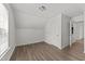Bright bedroom features clean white walls, wood-look flooring, and a double-door closet at 620 Hanska Way, Raleigh, NC 27610
