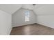 Attic bedroom features natural light, neutral walls, and wood-look floors at 620 Hanska Way, Raleigh, NC 27610