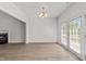 Dining room with hardwood floors and glass doors leading to the outdoor space at 620 Hanska Way, Raleigh, NC 27610