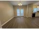 Open concept dining room with a chandelier and french doors at 620 Hanska Way, Raleigh, NC 27610