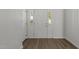 Entryway with a white front door with windows, and hardwood floors at 620 Hanska Way, Raleigh, NC 27610