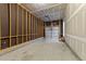 A spacious unfinished two-car garage with high ceilings offers many possibilities at 620 Hanska Way, Raleigh, NC 27610