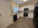 Kitchen featuring granite countertops, stainless steel appliances, and white cabinets at 620 Hanska Way, Raleigh, NC 27610