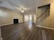 Spacious living room featuring a fireplace, ceiling fan, and hard surface flooring at 620 Hanska Way, Raleigh, NC 27610