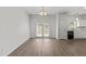 Bright living room with white walls, hardwood floors, and french doors that lead to outdoor space at 620 Hanska Way, Raleigh, NC 27610