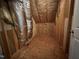 Unfinished attic storage space, showing rafters and insulation, ready for customization at 633 Prickly Pear Dr, Fuquay Varina, NC 27526