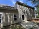 Exterior shot of the back of the house with vinyl siding and a small concrete patio at 633 Prickly Pear Dr, Fuquay Varina, NC 27526