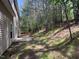 The backyard of the house with a wooded area in the background at 633 Prickly Pear Dr, Fuquay Varina, NC 27526
