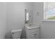 Bathroom featuring a sink and toilet with natural light at 633 Prickly Pear Dr, Fuquay Varina, NC 27526