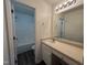 Bathroom featuring a vanity with a light stone countertop, ample lighting, and a tub/shower combo at 633 Prickly Pear Dr, Fuquay Varina, NC 27526