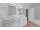 Bright bathroom with double vanity and quartz countertop at 633 Prickly Pear Dr, Fuquay Varina, NC 27526