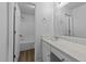 Bathroom featuring a white vanity, a large mirror, and a shower-tub combination at 633 Prickly Pear Dr, Fuquay Varina, NC 27526