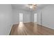Spacious bedroom featuring wood-look floors, neutral walls, and plenty of natural light at 633 Prickly Pear Dr, Fuquay Varina, NC 27526