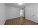 Bright bedroom showcasing wood-look flooring and a spacious closet at 633 Prickly Pear Dr, Fuquay Varina, NC 27526
