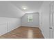 Bedroom features a window, plank floors, and white walls at 633 Prickly Pear Dr, Fuquay Varina, NC 27526