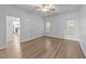 Bright bedroom features neutral walls, wood-look floors and a ceiling fan at 633 Prickly Pear Dr, Fuquay Varina, NC 27526