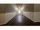 This bonus room includes hardwood floors, a window for natural light, and recessed lighting at 633 Prickly Pear Dr, Fuquay Varina, NC 27526
