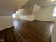 Large bonus room with wood floors, dormer windows for natural light, and ample storage at 633 Prickly Pear Dr, Fuquay Varina, NC 27526