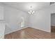 Dining room with wood-look floors, light fixture, and access to outside at 633 Prickly Pear Dr, Fuquay Varina, NC 27526
