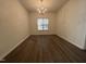 Dining room with wood floors and natural light at 633 Prickly Pear Dr, Fuquay Varina, NC 27526