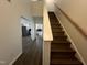 Interior view of foyer featuring hardwood flooring and a staircase leading to the upper level at 633 Prickly Pear Dr, Fuquay Varina, NC 27526