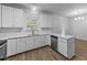 Kitchen with stainless steel dishwasher, sink, and ample counter space at 633 Prickly Pear Dr, Fuquay Varina, NC 27526