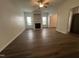 Living room with wood floors and a fireplace at 633 Prickly Pear Dr, Fuquay Varina, NC 27526