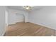 Bright living room featuring wood-look floors and a ceiling fan at 633 Prickly Pear Dr, Fuquay Varina, NC 27526