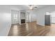 Cozy living room with a fireplace and hardwood floors, with natural light from multiple windows at 633 Prickly Pear Dr, Fuquay Varina, NC 27526