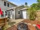 Backyard featuring wood deck with patio set and fire pit at 6718 Twin Tree Ct, Raleigh, NC 27613