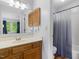 Bathroom with vanity with sink, large mirror, toilet, and shower/tub combo at 6718 Twin Tree Ct, Raleigh, NC 27613