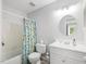 Neutral bathroom featuring vanity with sink, shower/tub combo, and toilet at 6718 Twin Tree Ct, Raleigh, NC 27613