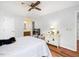 Bedroom with wood floor, ceiling fan, and ensuite bath at 6718 Twin Tree Ct, Raleigh, NC 27613