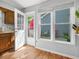 Bright breakfast nook with windows overlooking backyard and door to the outside at 6718 Twin Tree Ct, Raleigh, NC 27613