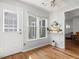 Bright breakfast nook features a door to the outside and large windows with shelf at 6718 Twin Tree Ct, Raleigh, NC 27613