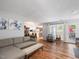 Bright living room with hardwood floors, neutral-toned furniture, and plenty of natural light at 6718 Twin Tree Ct, Raleigh, NC 27613