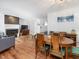 Open concept living space with dining area, fireplace, and hardwood floors, perfect for entertaining at 6718 Twin Tree Ct, Raleigh, NC 27613