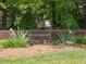 Community entrance sign with manicured landscaping welcoming you to Westwood at 6718 Twin Tree Ct, Raleigh, NC 27613