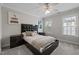 Bedroom with a large bed, stylish decor, and natural light from the windows at 703 Kirkeenan Cir, Morrisville, NC 27560