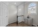 Bright entryway showcasing hardwood floors, a staircase, an arched window and a decorative console table at 703 Kirkeenan Cir, Morrisville, NC 27560