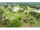 Aerial view of the golf course, highlighting ponds, sand traps, and manicured greens at 703 Kirkeenan Cir, Morrisville, NC 27560