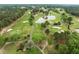 Overhead shot of the golf course with ponds, and lush greenery at 703 Kirkeenan Cir, Morrisville, NC 27560